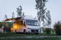 Ameglia, La Spezia, Italy - july 5, 2019: Malibu Carthago mobile home parked in River Village Camping. Evening