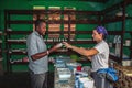 Ameircan pharmacist tells Haitian interpreter about a medicine.