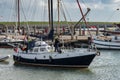 Sailboat departs from the port of Nes in Ameland and goes to the Wadden Sea
