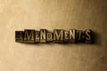 AMENDMENTS - close-up of grungy vintage typeset word on metal backdrop