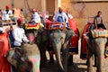 Amer Fort or Amber Fort. Decorated elephants and elephant riders waiting for tourists