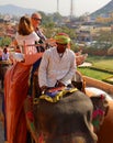 Amer Fort or Amber Fort. Decorated elephants and elephant riders waiting for tourists