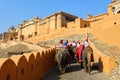 Amer Fort or Amber Fort. Decorated elephants and elephant riders waiting for tourists