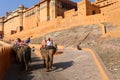 Amer Fort or Amber Fort. Decorated elephants and elephant riders waiting for tourists