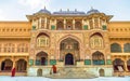 Amer Fort main palace gateway with medieval Indian wall artwork at Jaipur, Rajasthan