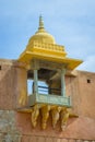 Amer, India - September 19, 2017: Beautiful view of a balcony with a yellow dome in Amber Fort palace, located in Amer