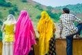 Amer, India - September 19, 2017: Unidentified people posing in a stoned wall and enjoying the view of Maota Lake in