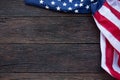 America flag waving pattern on wooden background in table top view, red blue white strip concept for USA 4th july independence day Royalty Free Stock Photo