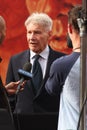 American actor Harrison Ford in professional suit giving interview during an event