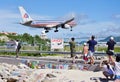 An American Airlines Boeing 757 lands over Maho Beach in St Martin