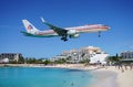An American Airlines Boeing 757 lands over Maho Beach in St Martin