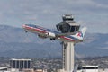 American Airlines Boeing 737 taking off in from of the control tower at Los Angeles International Airport. Royalty Free Stock Photo