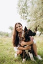 American Akita dog for a walk with a guy and a girl