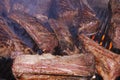 american angus cattle beef spare ribs marinade on a barbeque grill on fire