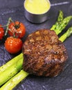 American angus tenderloin steak with asparagus and cherry tomato