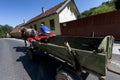 A countryside man riding a horse cart in the middle of the street out in the heart of Transylvania road district of Sibiu near Buc Royalty Free Stock Photo