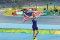 American athlete celebrates with American flag