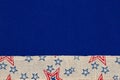 American background with retro USA stars and stripes burlap ribbon on blue Royalty Free Stock Photo