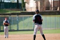 Youth baseball pitcher in black and grey