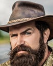 American beard cowboy. Leather Cowboy Hat. Portrait of young man wearing cowboy hat. Cowboys in hat. Handsome bearded Royalty Free Stock Photo