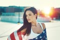 American beauty covered by star spangled banner in sunset Royalty Free Stock Photo