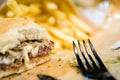 american beef hamburger with cheese and french fries at beautiful fast food and cafe bistro.delicious low price hamburger in Royalty Free Stock Photo