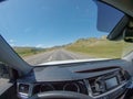 American Bison Grazing by Roadside With Passing Cars