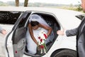 american black african bride jewelry head sits in a white car on wedding day with flowers Royalty Free Stock Photo