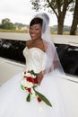 american black bride with limousine wedding car Royalty Free Stock Photo