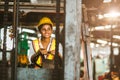 American black women labor worker at forklift driver happy working in industry factory logistic shipping warehouse Royalty Free Stock Photo