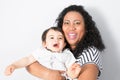 American black young mother plays with a baby. A woman plays with mixed race child Royalty Free Stock Photo