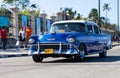 American blue classic car as taxi in havana city on the malecon