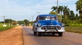 American blue classic car on the road in cuba Royalty Free Stock Photo