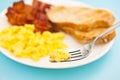 American breakfast, bacon and scrambled egg blurry