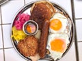 American Breakfast with Pancake Maple Syrup, Sunny Side Up Eggs, Hash Brown, Sausage, Turmeric Pickled Onions and Pickle Royalty Free Stock Photo