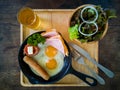 American breakfast with salad and apple juice at resort thailand. Royalty Free Stock Photo