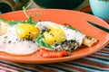 American breakfast with sunny side up eggs, bacon, toast, pancakes, coffee and juice, wood background Royalty Free Stock Photo