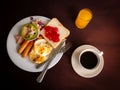 American Breakfast in a White Plate with a Knife and Fork Royalty Free Stock Photo