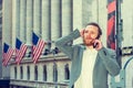 Young man traveling in New York City, talking on cell phone Royalty Free Stock Photo