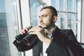 American businessman using binoculars Royalty Free Stock Photo