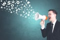 American businessman yelling through a megaphone Royalty Free Stock Photo