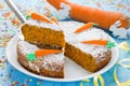 American carrot cake decorated with powdered sugar and marzipan