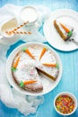 American carrot cake decorated with powdered sugar and marzipan