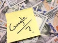 American cash money and yellow paper note with text Google with question mark