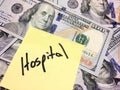 American cash money and yellow paper note with text Hospital