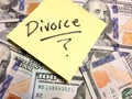 American cash money and yellow post it note with text Divorce with question mark