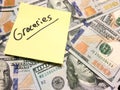 American cash money and yellow post it note with text Groceries Royalty Free Stock Photo