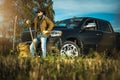 American Caucasian Farmer Staying Next to His Pickup Truck