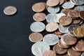 American cents coins are scattered on a black wooden surface. Money background Royalty Free Stock Photo