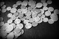 American cents on a dark surface. Black and white Royalty Free Stock Photo